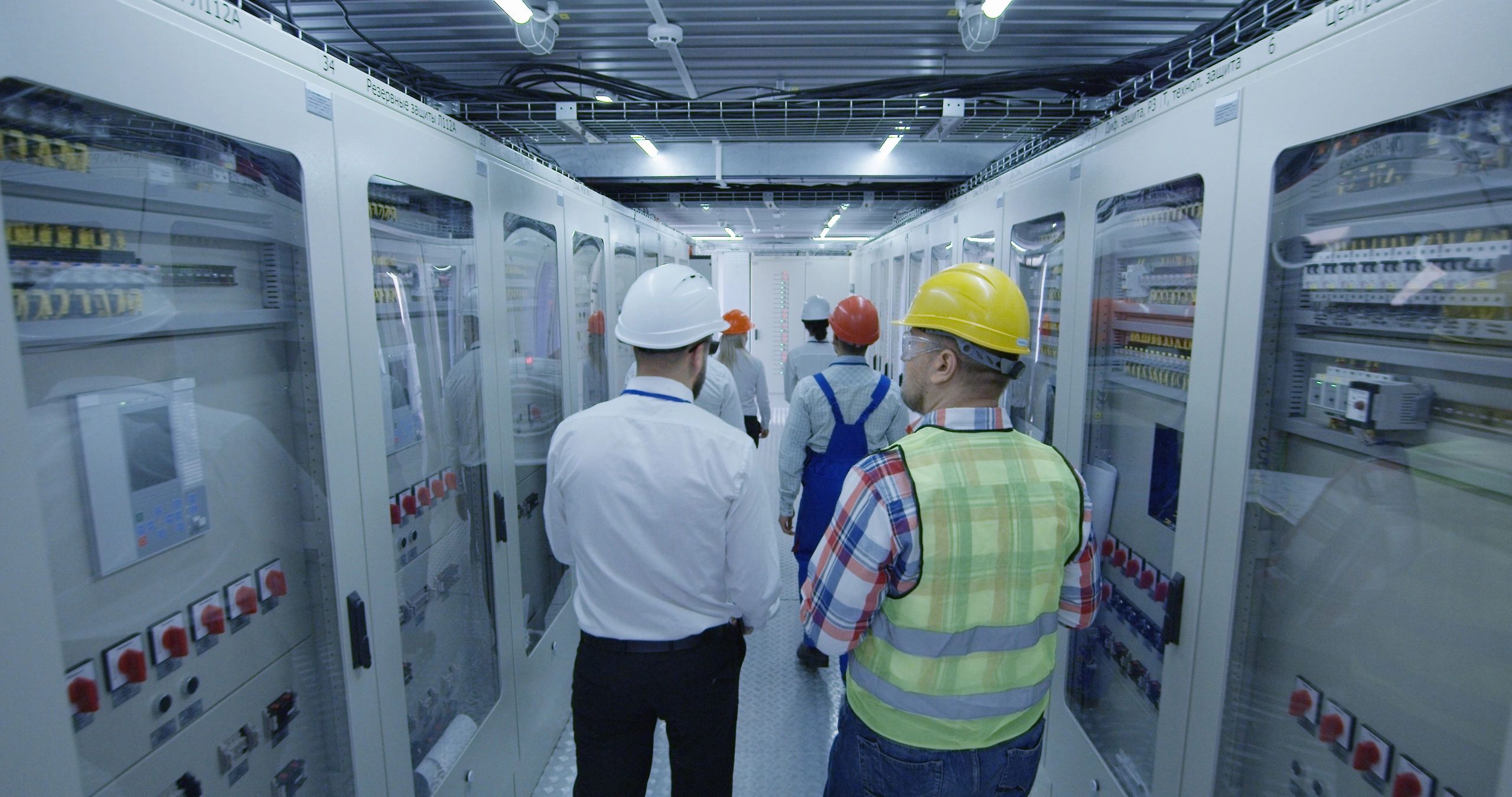 Engineers reviewing operations in an industrial control room
